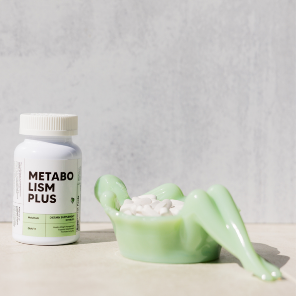 Metabolism Plus bottle of MetaMulti with a dish containing white pills next to it