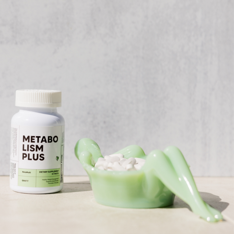 Metabolism Plus bottle of MetaMulti with a dish containing white pills next to it