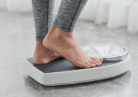 woman's feet on a weight scale