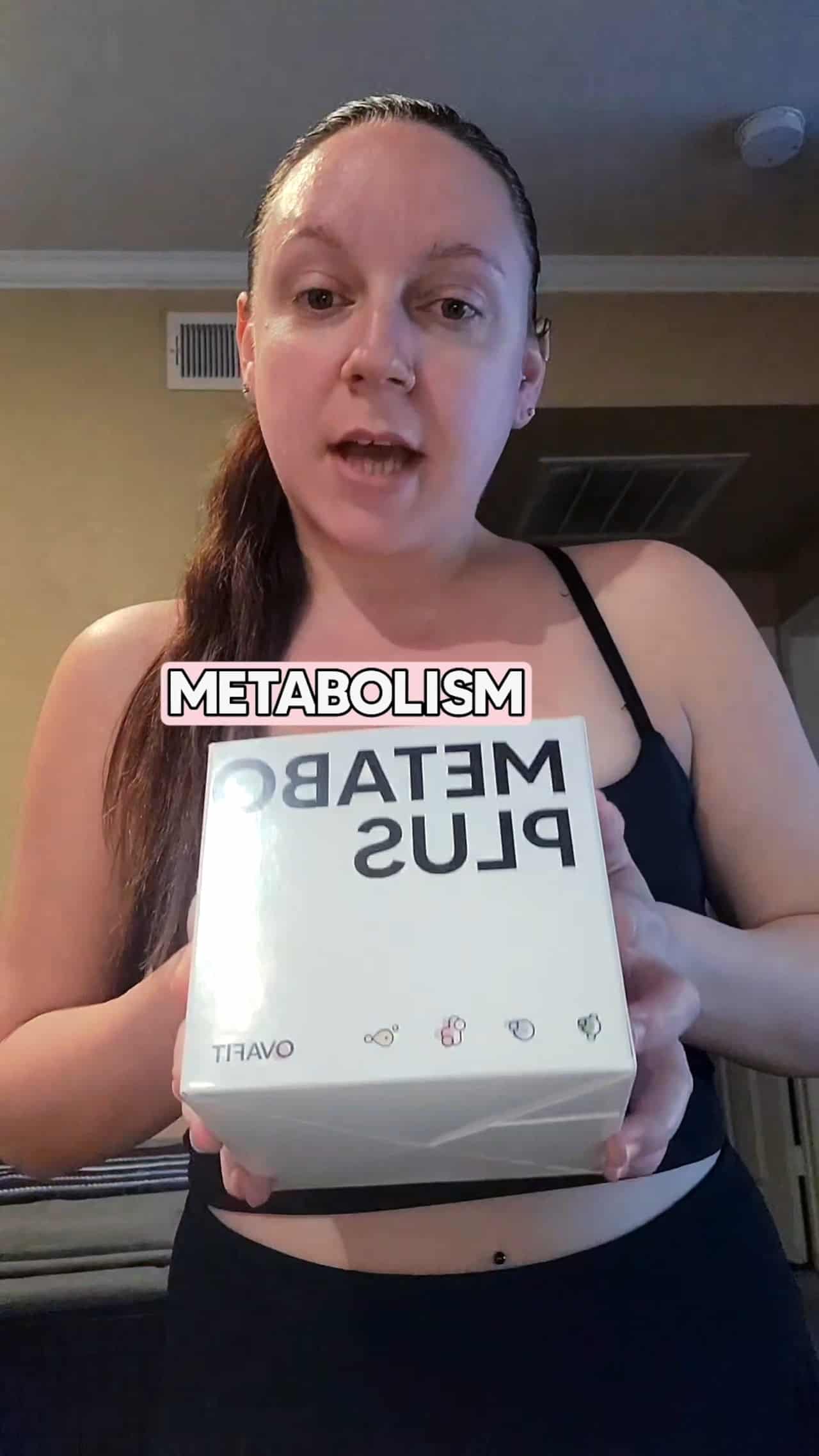 woman holding a package of metabolism plus supplements giving a testimonial