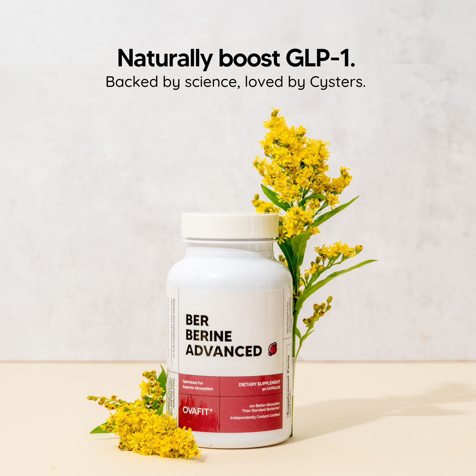 bottle of supplements with a flower next to it