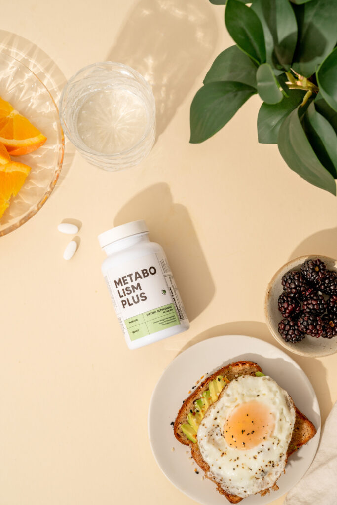 Berberine Advanced NSF certification Metabolism Plus Multivitamin bottle on a table with breakfast foods