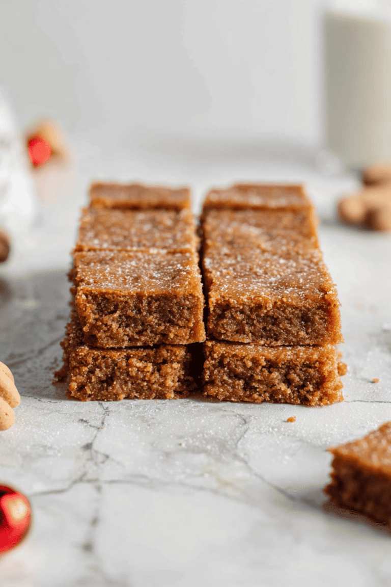 homemade chewy gingerbread bars stacked on the counter