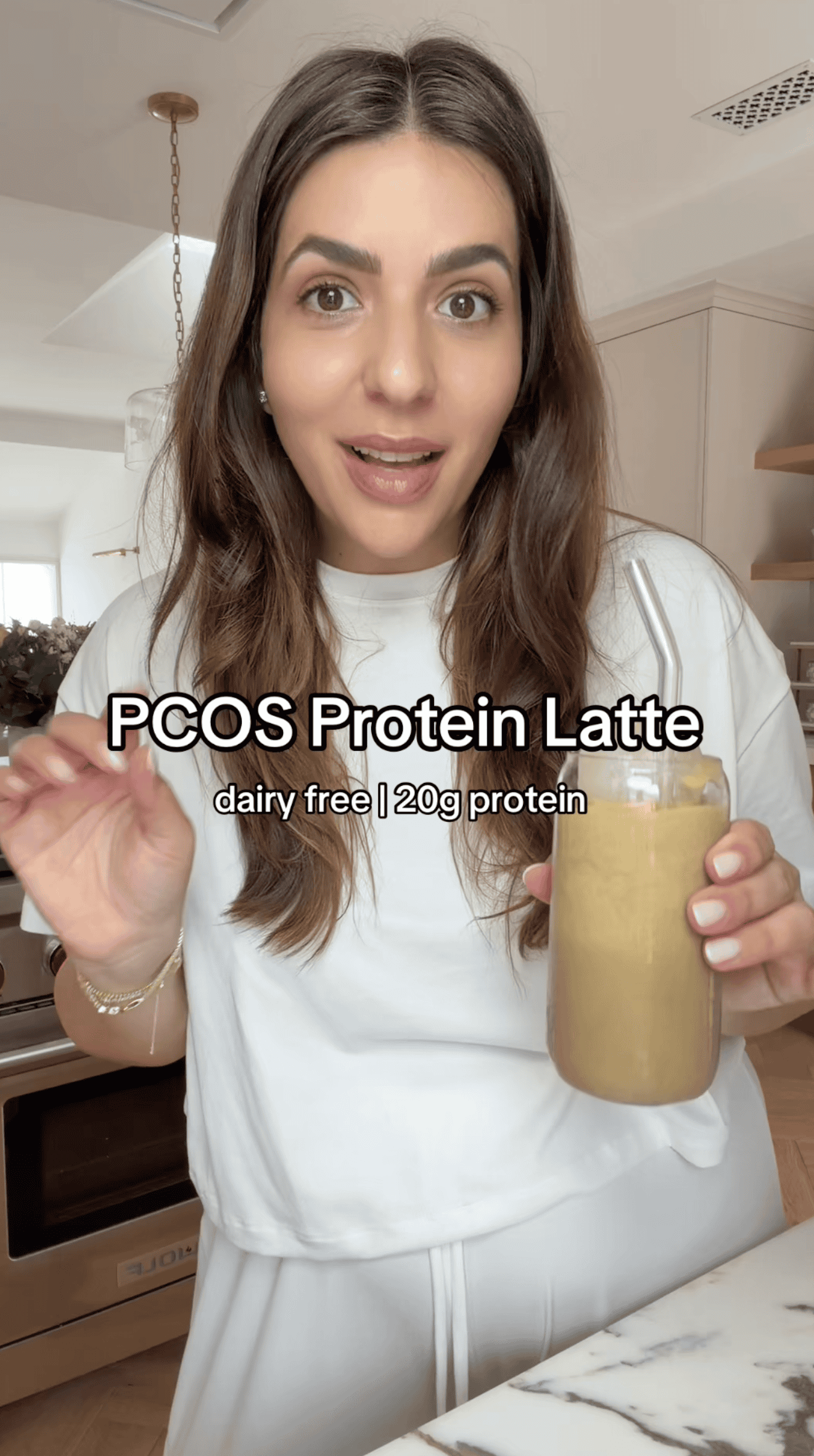 holding protein drink in hand