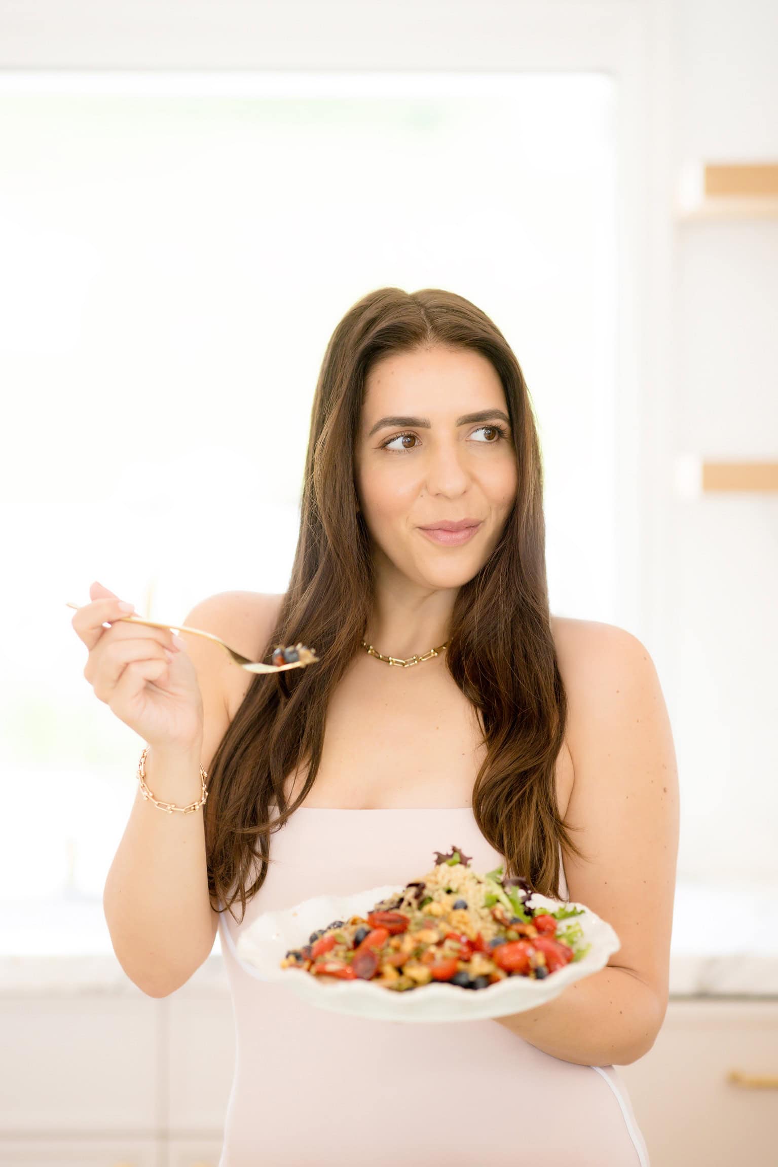 woman holding plate of food