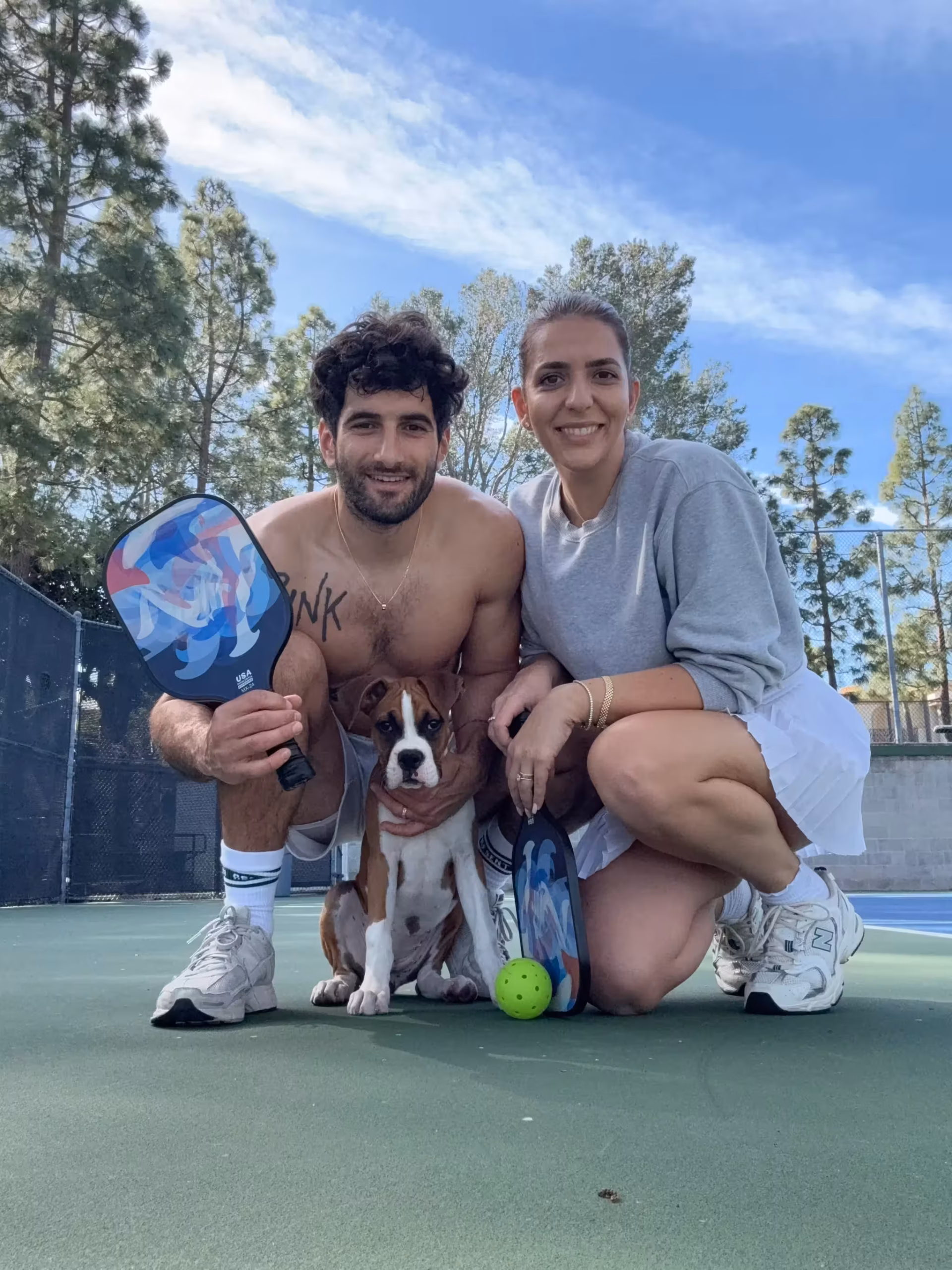 Sirak, Tallene and dog Kismet on the pickleball court