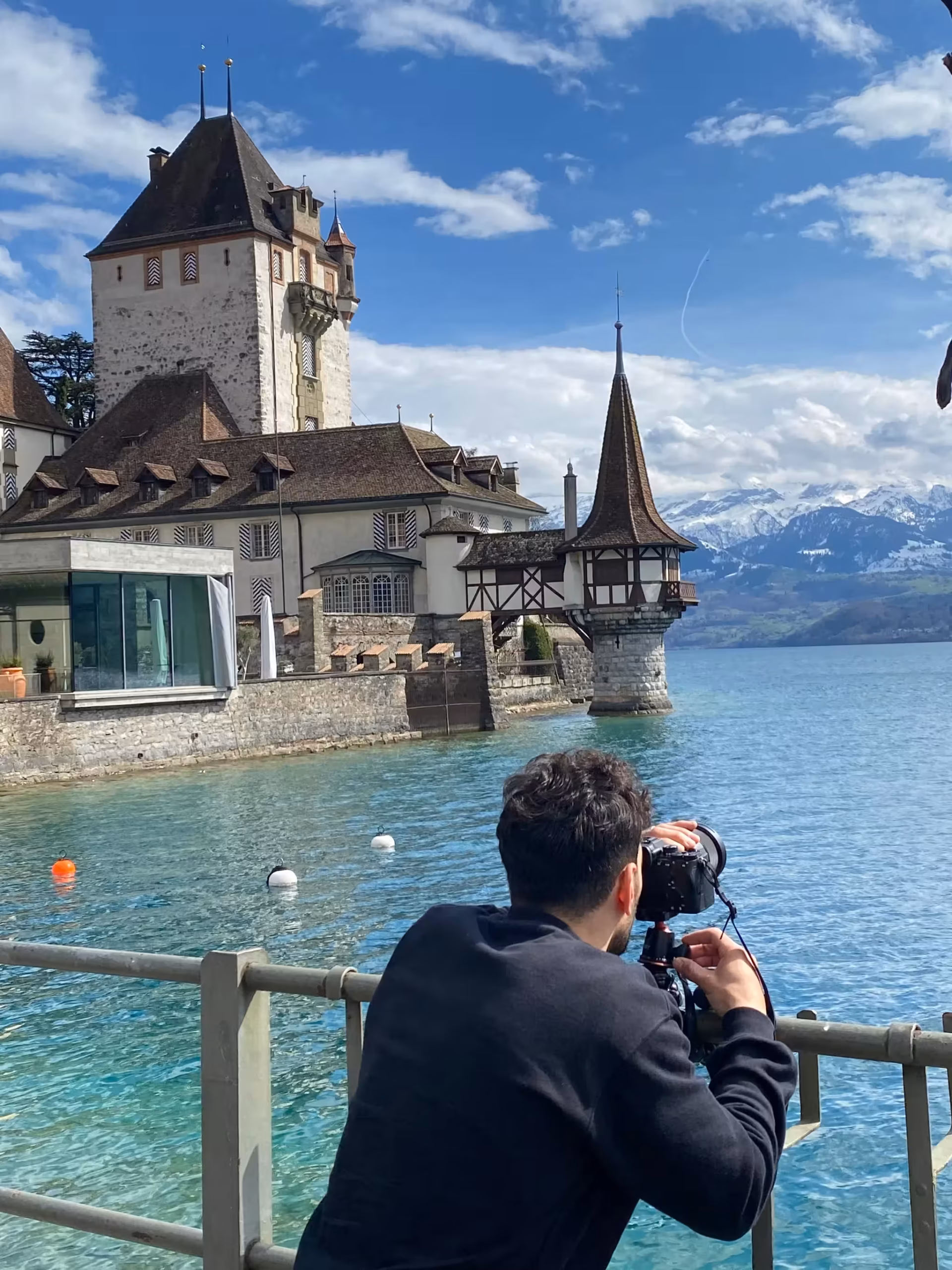 Sirak taking a photo over a lake