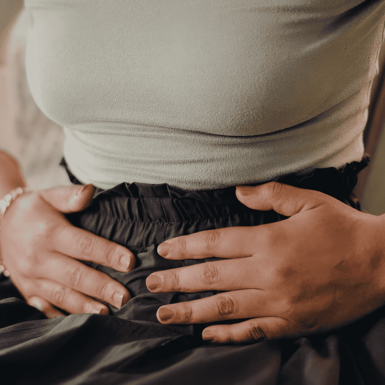 woman holding her abdomen